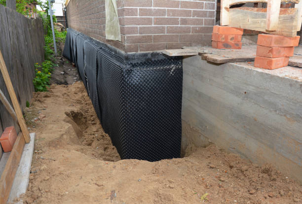 SJ Waterproofing Pros technician performing targeted Waterproofing assessment in Burlington, KY